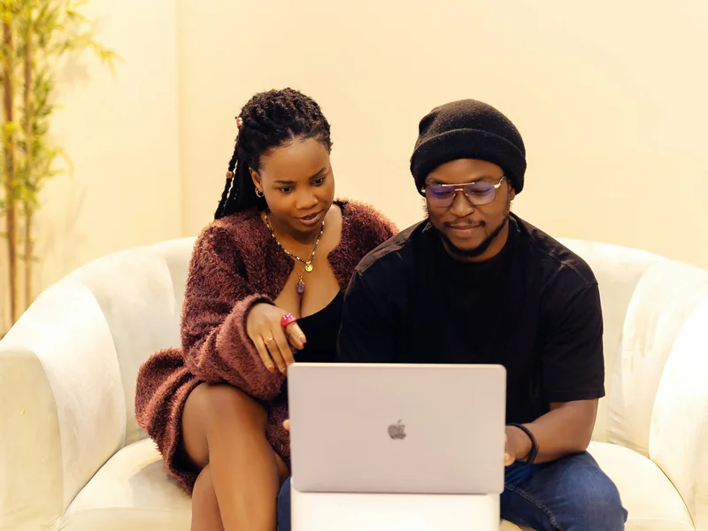Couple applying for Blue Frog Loans online from home on a laptop